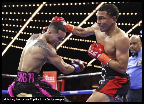 Alumnus Jose Ramirez (left) successfully defended his WBO super